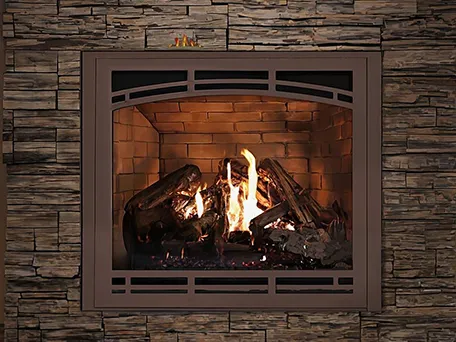 Modern gas fireplace with realistic log set and bronze frame.
