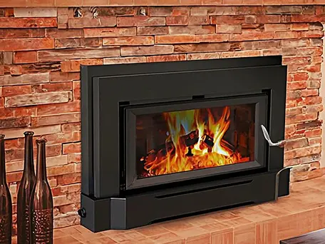 Modern black wood-burning fireplace insert with glowing fire