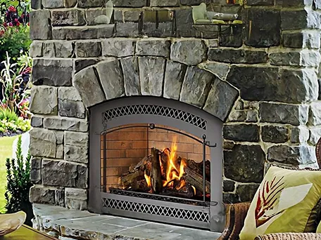 Corner gas fireplace with realistic log set, providing warmth and ambiance.